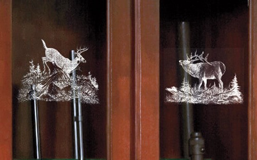 wooden gun rack with deer etchings